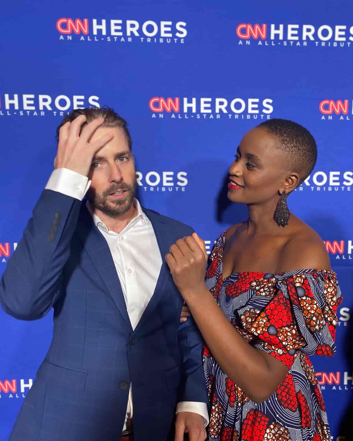 A side Portrait Nelly Cheboi and Tyler Cinnamon at the CNN Heroes red carpet