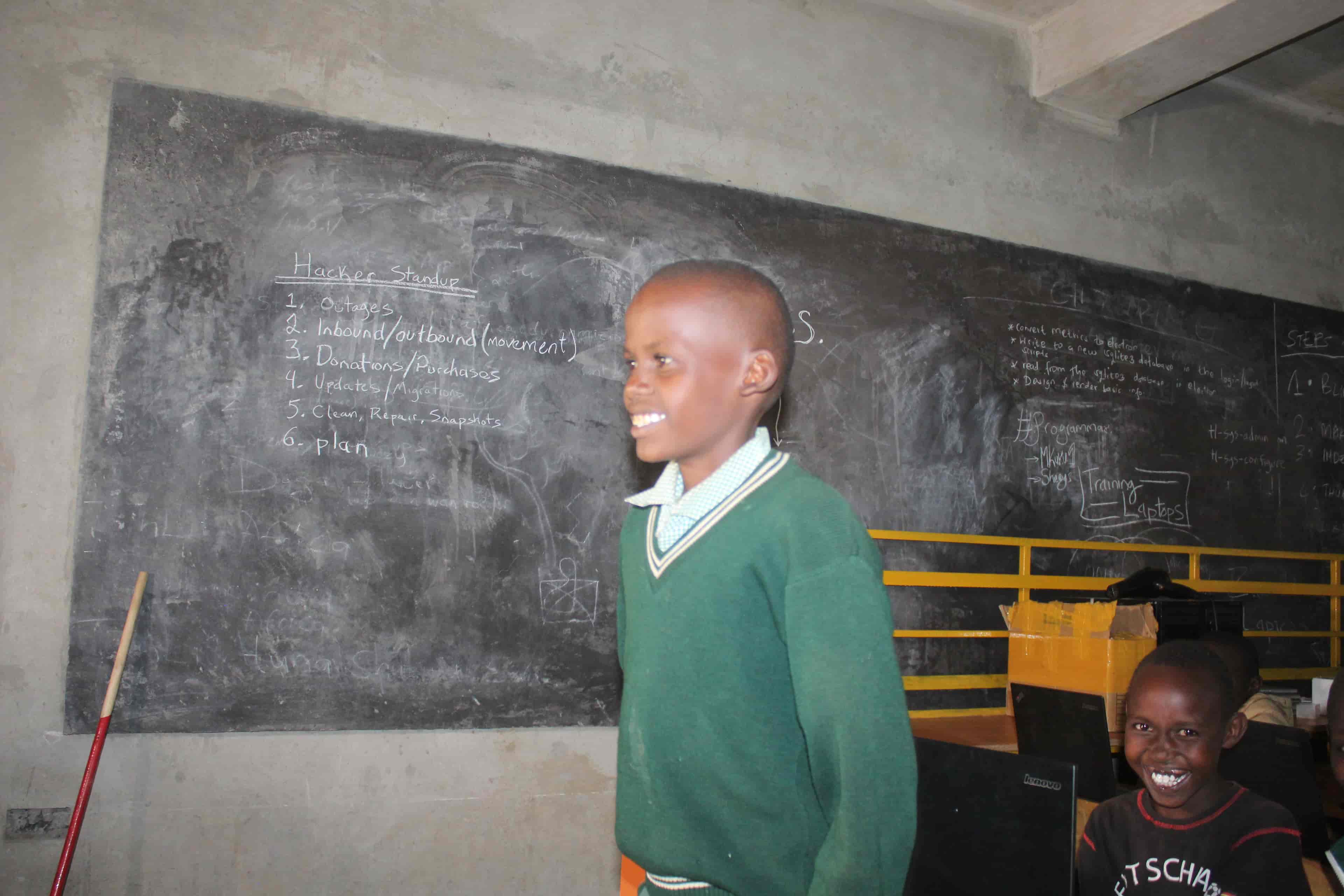 Ogutu standing in front of the zoom call asking questions about Space in the NASA activity