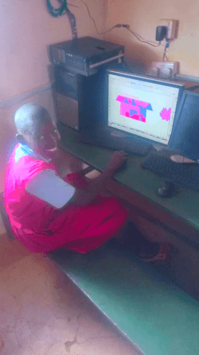 Primary Schools Confident Student Pink Uniform At Computer