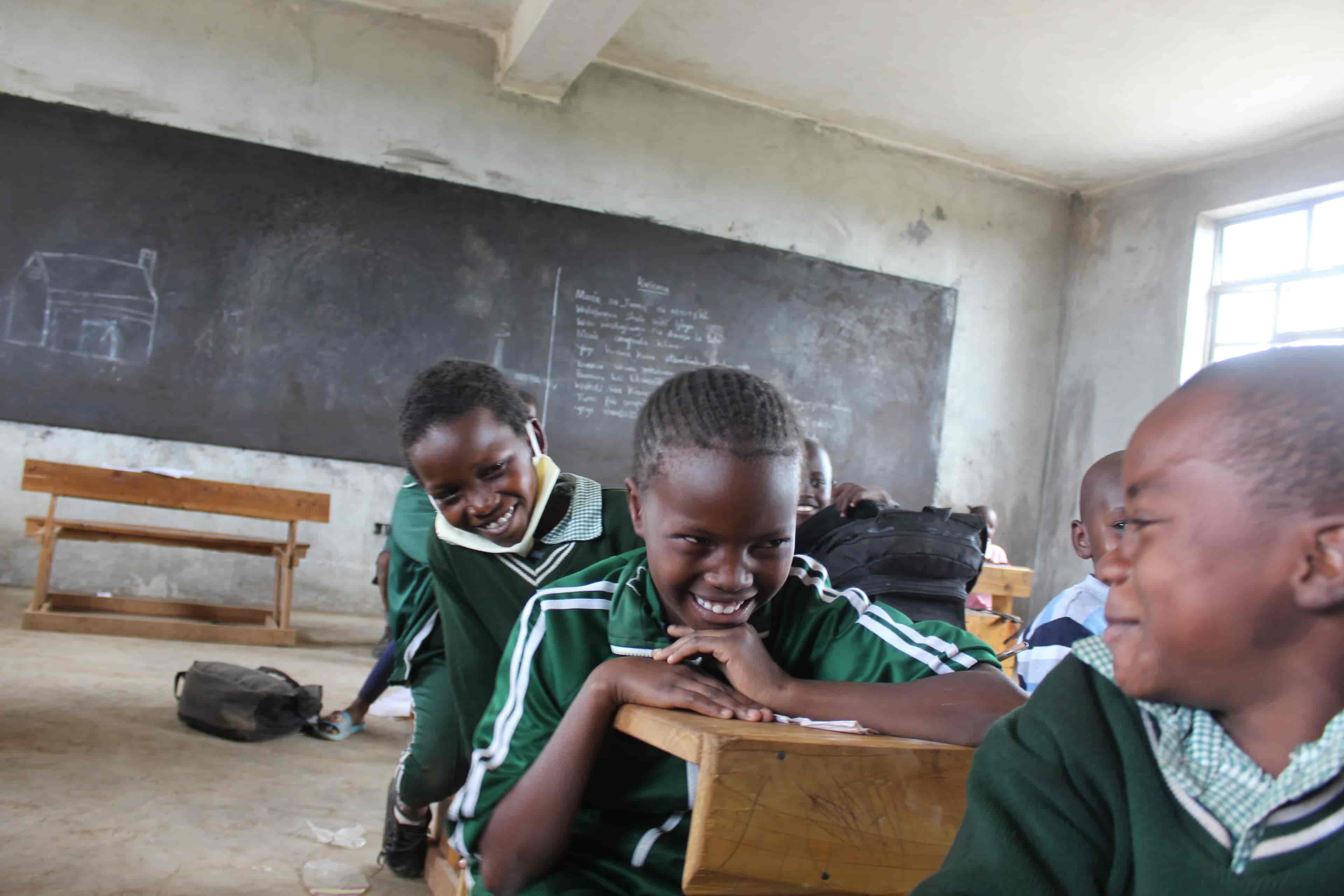  A Group Of Student Sitting At A Desk In Zawadi Yetu Mogotio Classroom