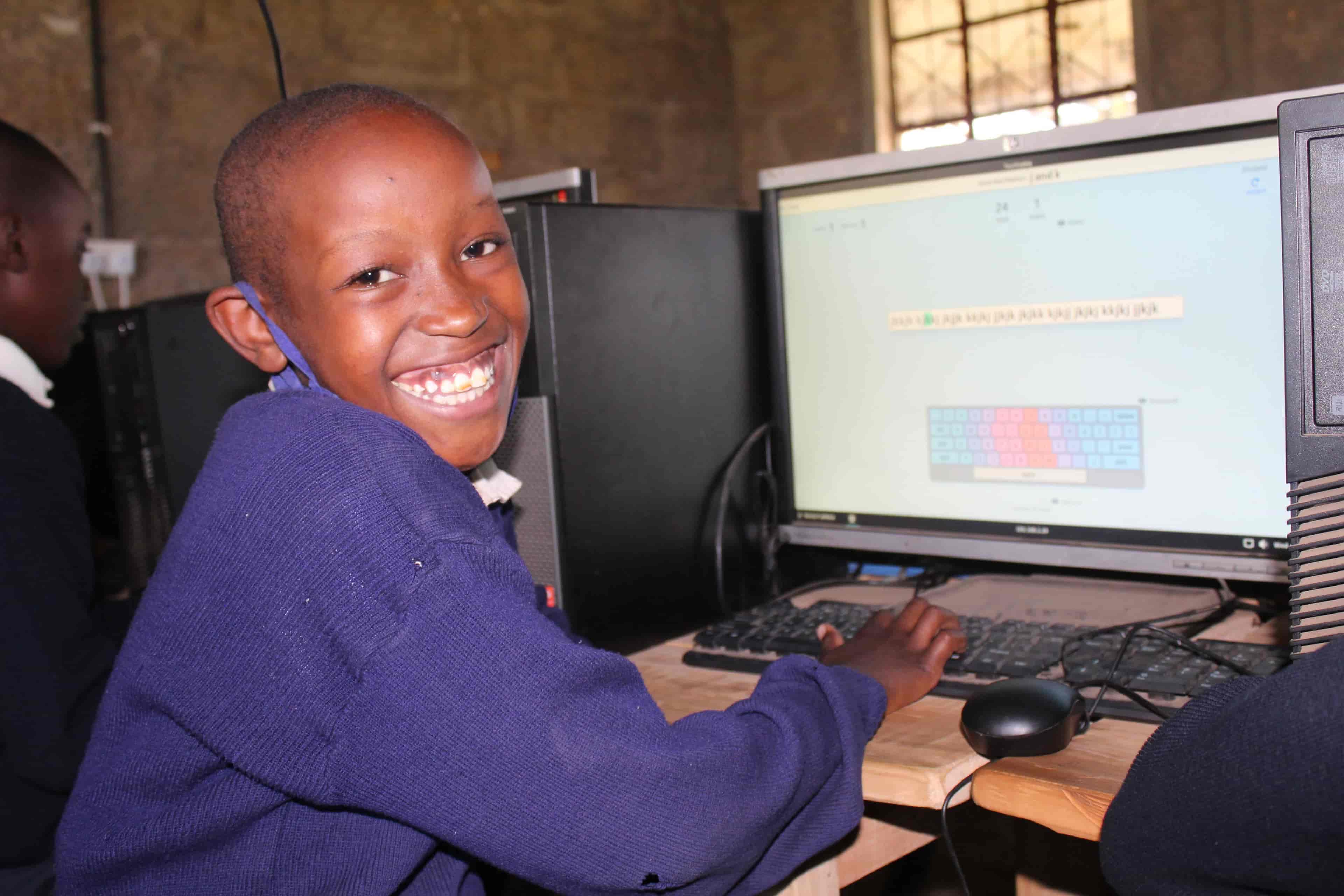  Gloria Wangui Sitting At Sainty Mary's computer lab Touch Typing